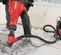 Red and black HILTI Demolition Breaker Jack Hammer Kit, Electric-powered, 35 lbs.