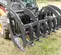 Gray Paladin Root Grapple Bucket Attachment on a Skid Steer